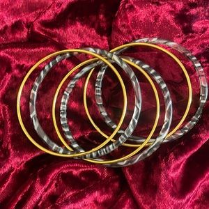 Gold and black bangles